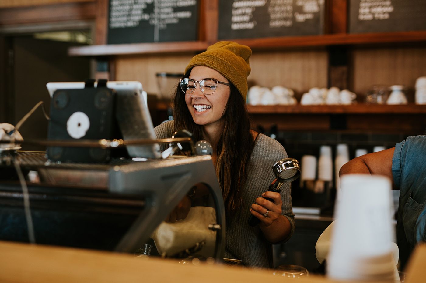 A cafe owner at the counter