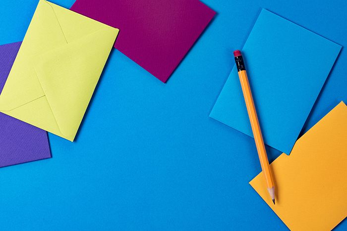 Colourful stationery on a blue desk