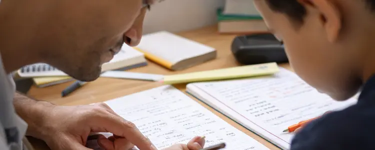 Tutor guides student through homework on a desk with worksheets.